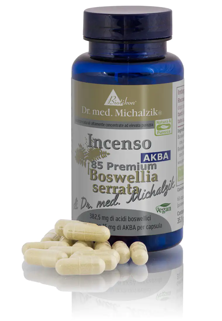 Boswellia Serrata 382,5 mg - Capsule Confezione di capsule di Boswellia Serrata, 60 pezzi in un contenitore di vetro blu, con diverse capsule accanto.